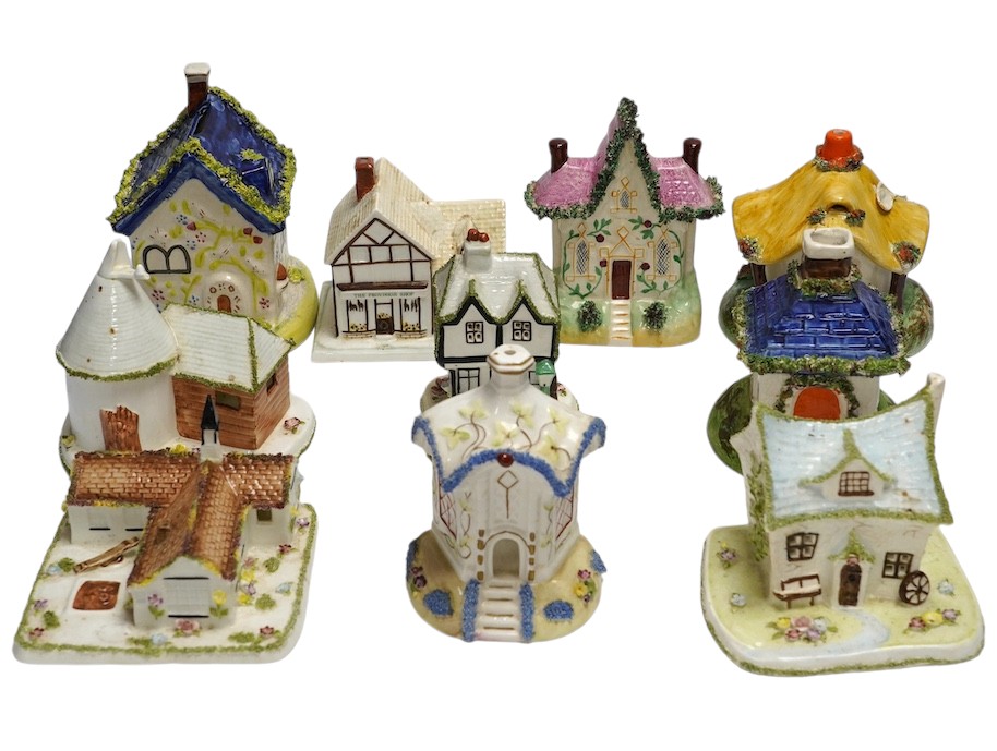 Ten various ceramic model cottages. Condition - fair to good